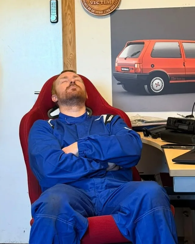 JP asleep in the office chair
